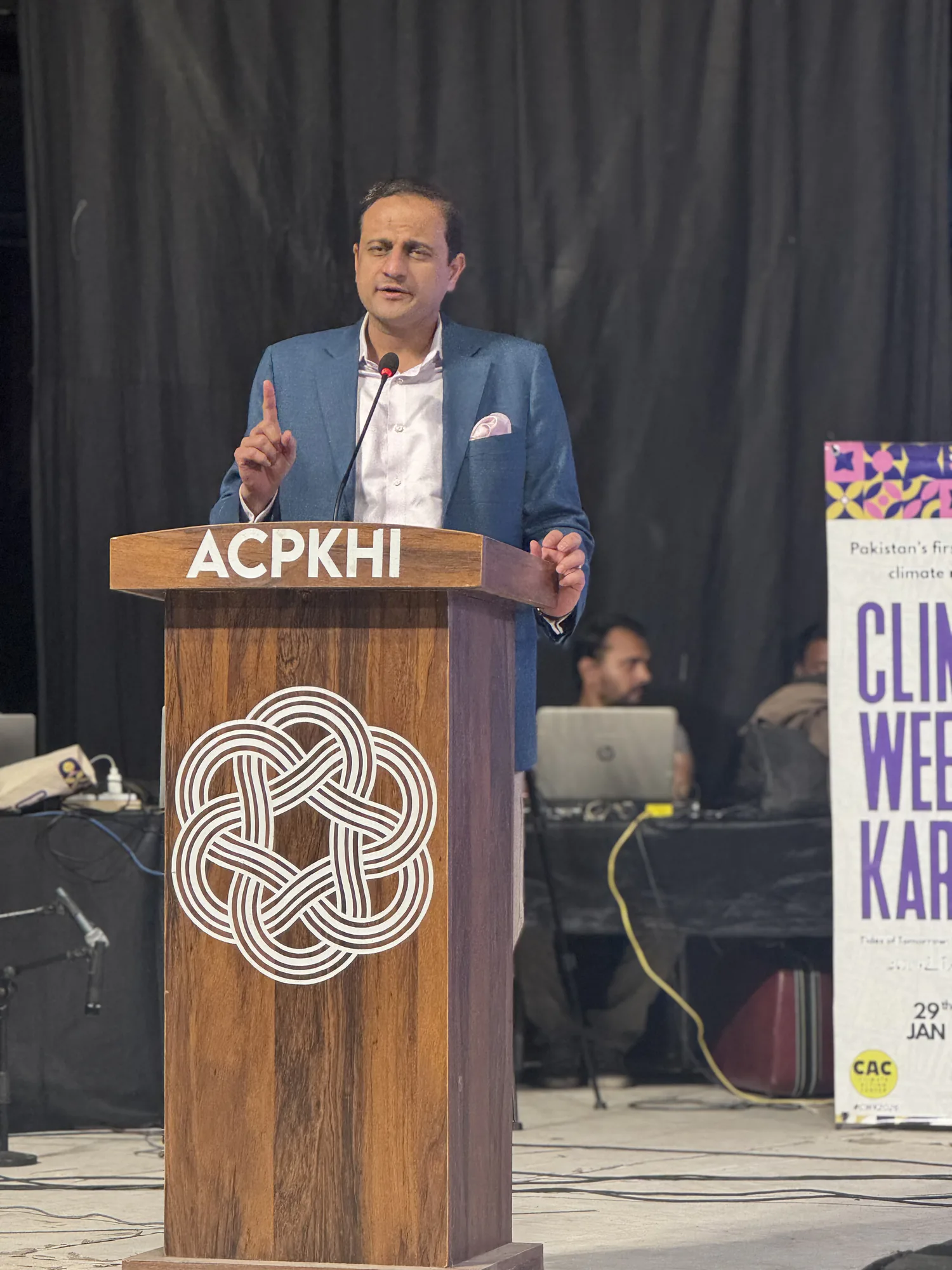 Urban policy speaker presenting at a Karachi city forum