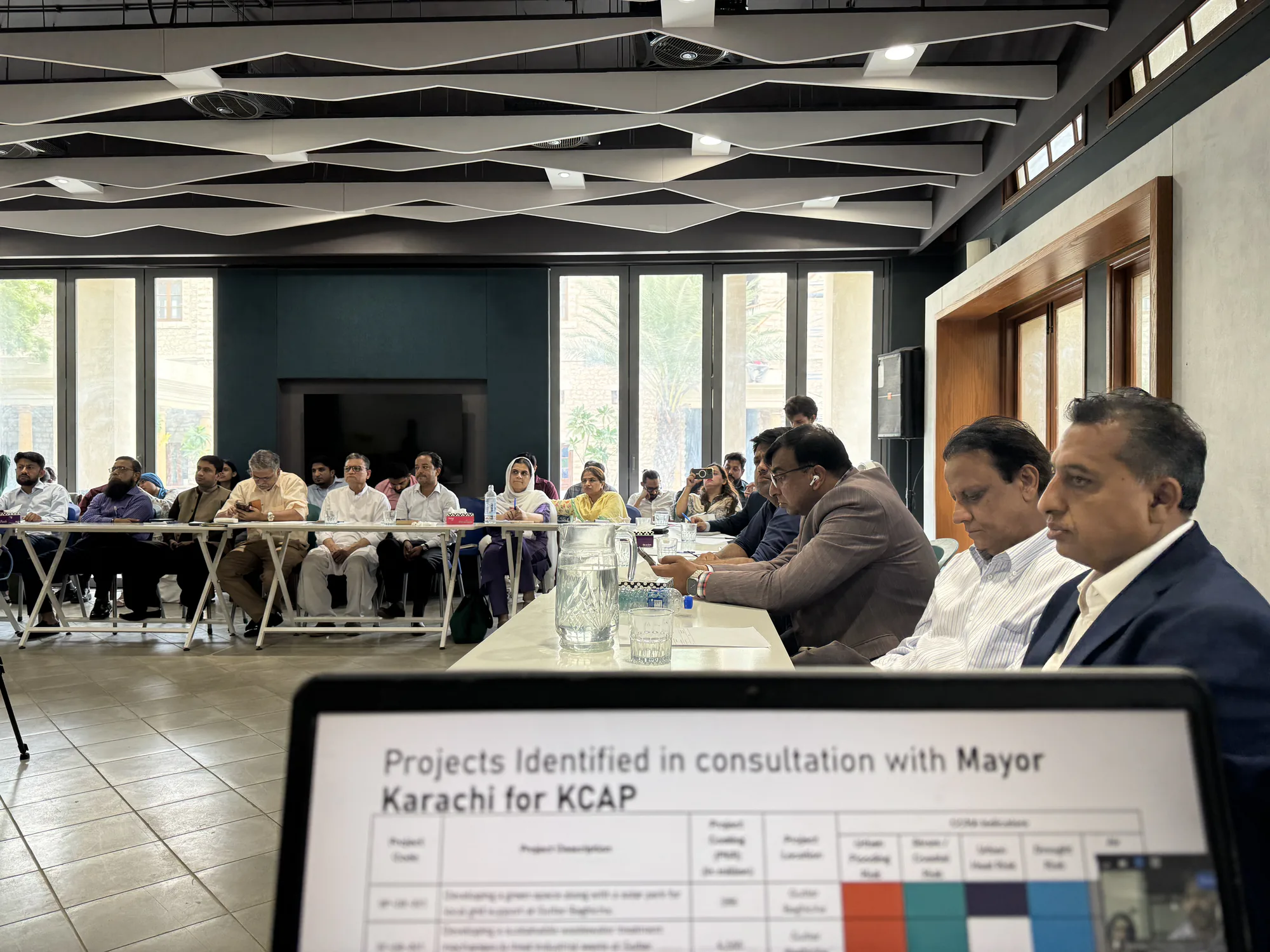 City stakeholders meeting around a conference table in Karachi