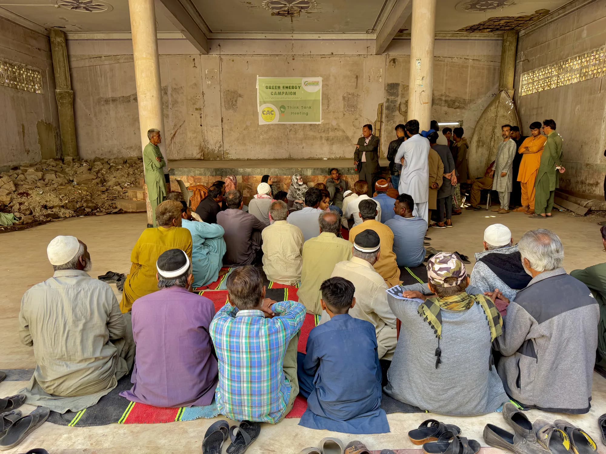 Community members gathered for a green energy programme in Karachi